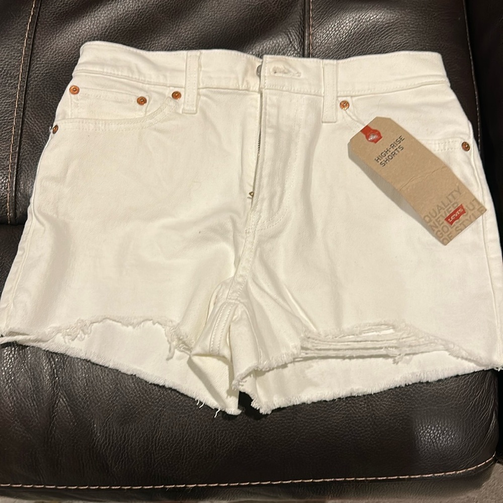 NWT Levi’s white denim shorts. High waist. I think it runs a bit small. Snug fit